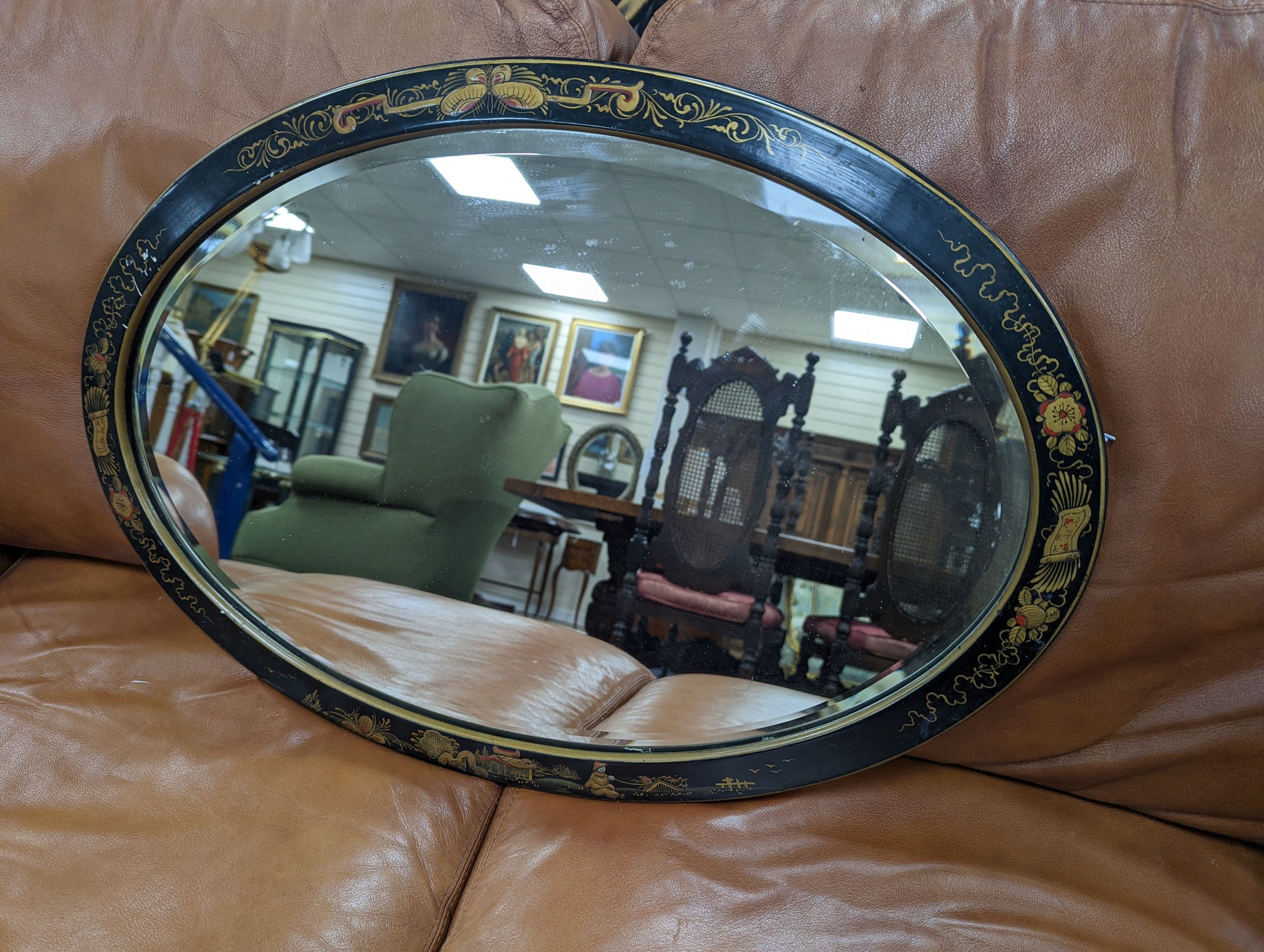 A 1920's oval chinoiserie lacquer wall mirror, width 67cm, height 46cm - To be sold on behalf of The Ukraine Appeal